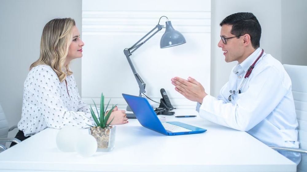 emergency-medical-coverage-business-travel Doctor discussing medical care with a patient during a consultation